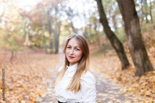 young blonde in the autumn park © Cavan