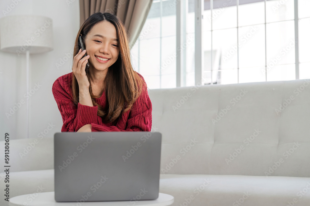Satisfied asian woman relaxing on comfortable couch, using laptop at home, happy girl chatting with friends in social network, spending lazy weekend, watching movie, shopping online, writing email Satisfied asian woman relaxing on comfortable couch, using laptop at home, happy girl chatting with friends in social network, spending lazy weekend, watching movie, shopping online, writing email