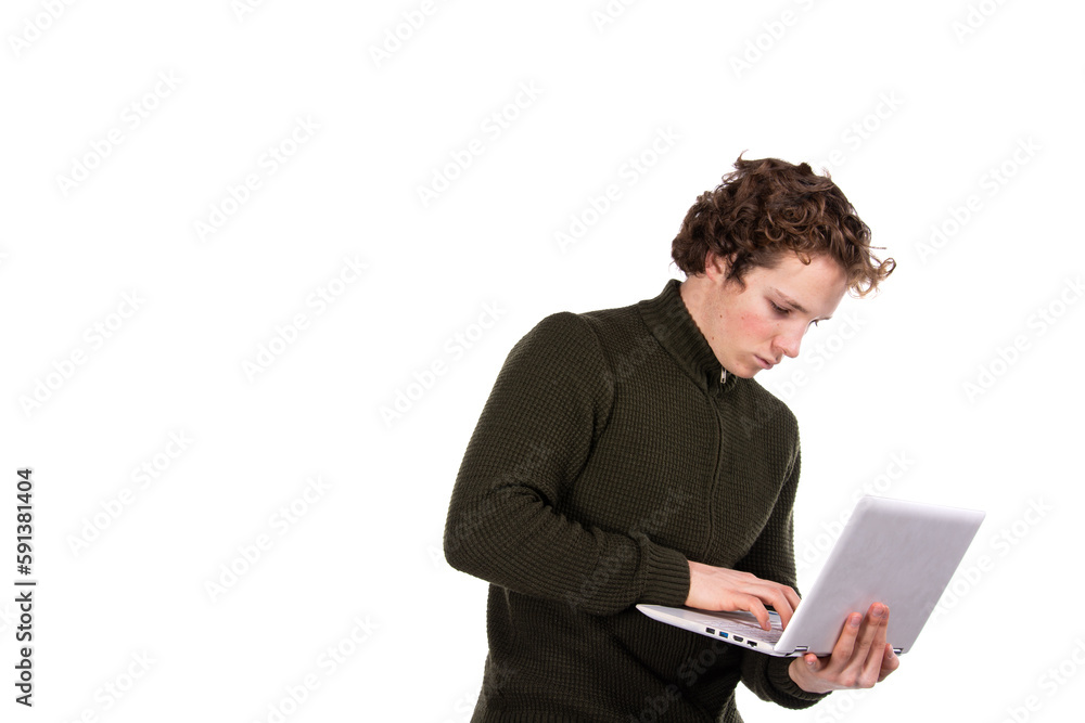 A young attractive man is working on a laptop. Early morning. White background. A young attractive man is working on a laptop. Early morning. White background.