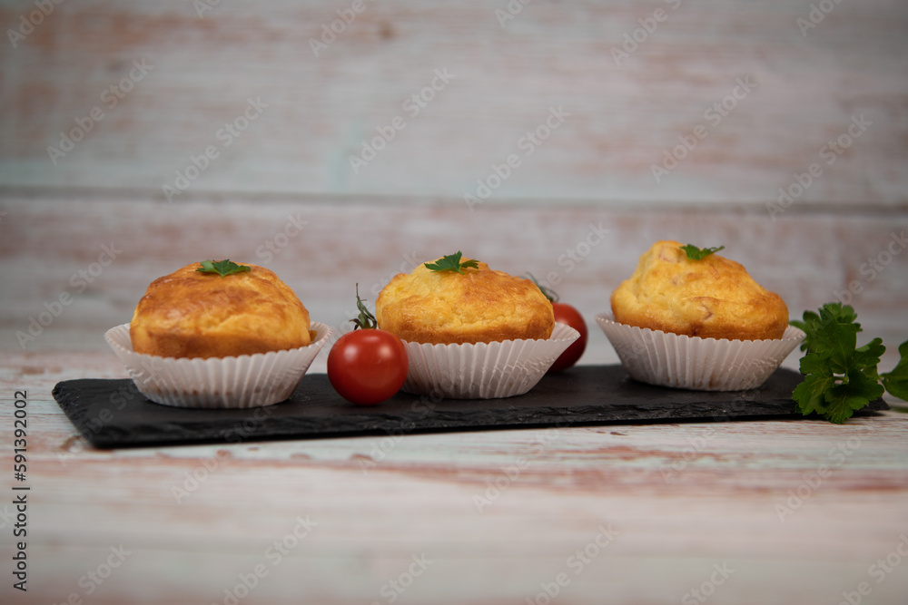Savory muffin with ham and cheese on blue background, High quality photo Savory muffin with ham and cheese on blue background, High quality photo