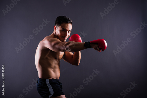Training, young man and boxer with boxing gloves for competition, prepare for match