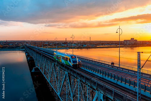 Passenger train moving across the bridge. Most im. Legionów Piłsudskiego, Płock.