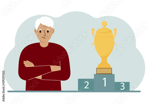A old man next to the pedestal on which the cup for victory and first place.
