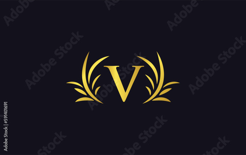 Golden laurel wreath leaf logo design vector with the letters and alphabets and bamboo leaf
