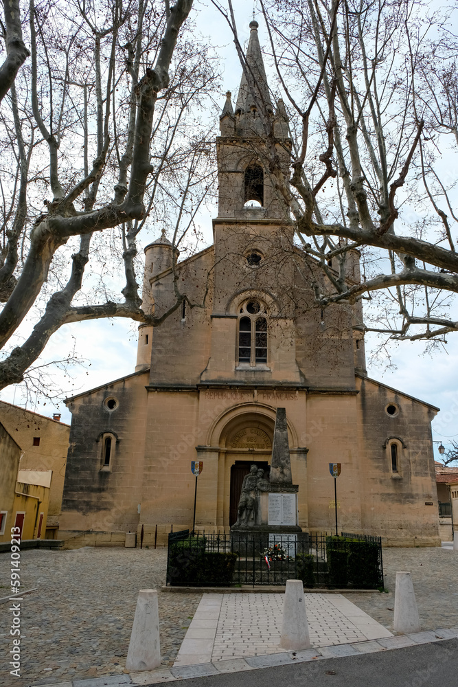 March 18, 2023. Pernes-les-Fontaines, Provence-Alpes-Côte d'Azur, France. The war memorial who have died in wars for France in front of St. Augustine Church. Cultural center in 1986. March 18, 2023. Pernes-les-Fontaines, Provence-Alpes-Côte d'Azur, France. The war memorial who have died in wars for France in front of St. Augustine Church. Cultural center in 1986.
