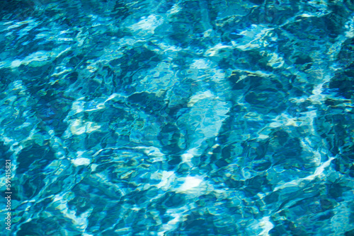Pool water background, blue wave abstract or rippled water texture background. © Volodymyr
