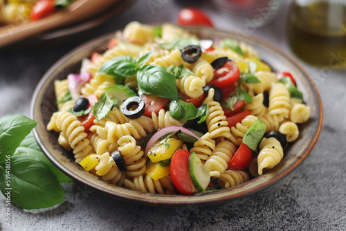A bowl with traditional Italian pasta salad 