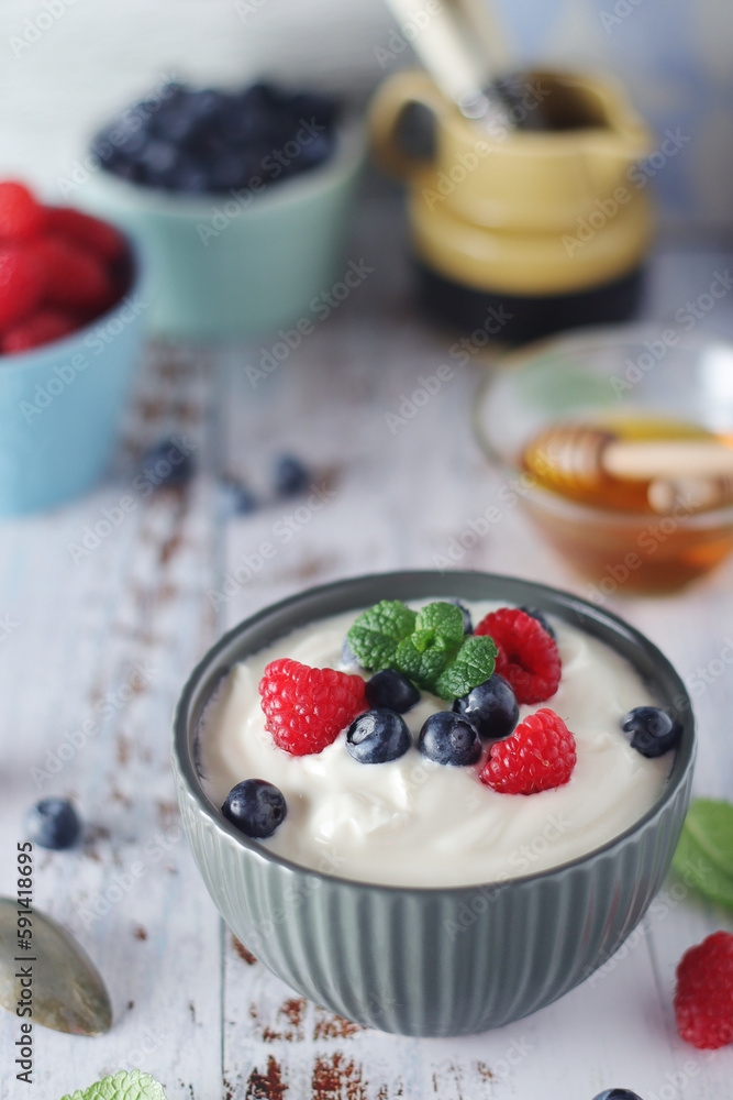 A bowl with Greek yogurt with berries A bowl with Greek yogurt with berries