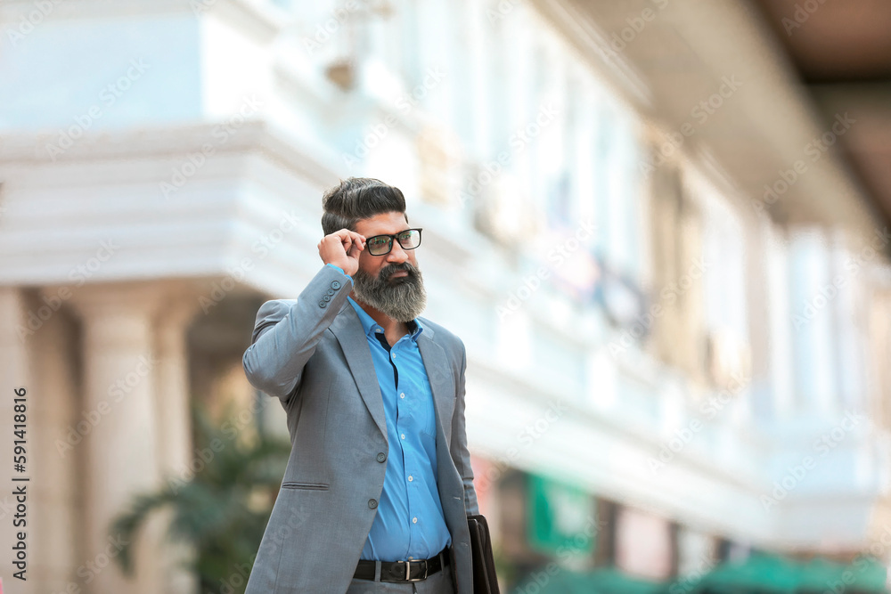 Fototapeta premium Confident Indian corporate man giving expression.