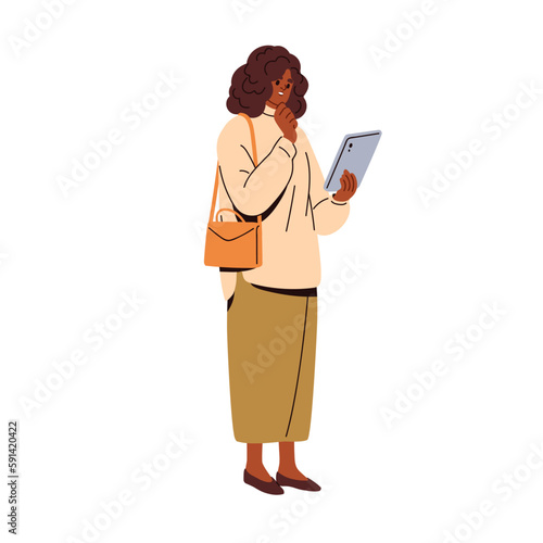 Modern black businesswoman looking at tablet PC in hand. Business woman using...