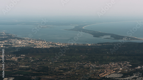 Aerial view of the endless coastline at sunset facing the Atlantic Ocean in Setubal near Lisbon, Portugal.