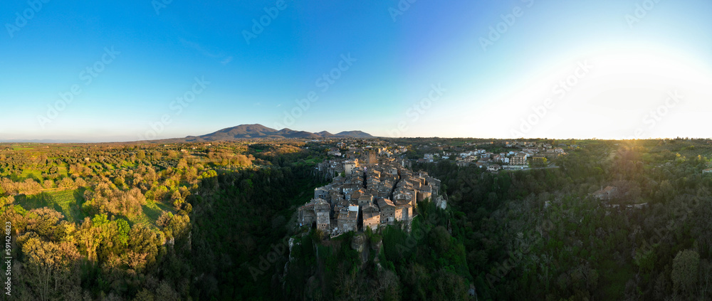 View from above, stunning panoramic view of the village of Vitorchiano at sunset. Vitorchiano is a medieval Italian village in Viterbo Province, Lazio, Italy.