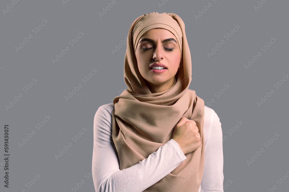 Muslim woman in hijab looking determined and confident Muslim woman in hijab looking determined and confident