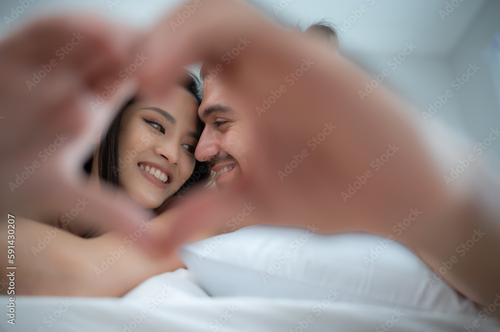Gorgeous sexy couple enjoying sex in the house's bedroom, Concept of as emotional relationships passion and love Gorgeous sexy couple enjoying sex in the house's bedroom, Concept of as emotional relationships passion and love