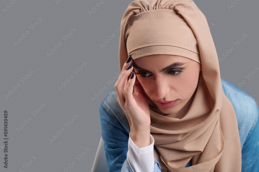 Young muslim woman feeling stressed and upset Young muslim woman feeling stressed and upset
