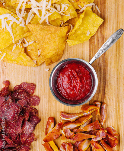 sujuk, smoked pork ears and mexican chips photo