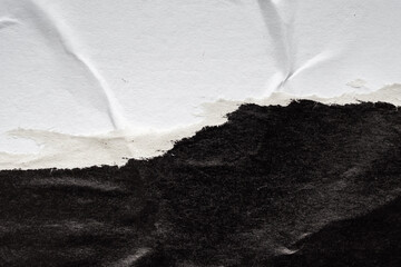 Old grunge ripped torn black paper poster surface texture background