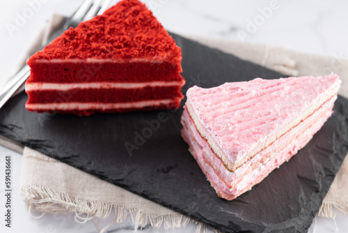 Set of cake portions, velvet and strawberry cake on marble.