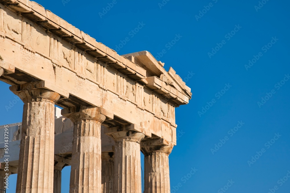 Low angle shot of the Parthenon against a blue sky in Athens, Greece on a sunny day