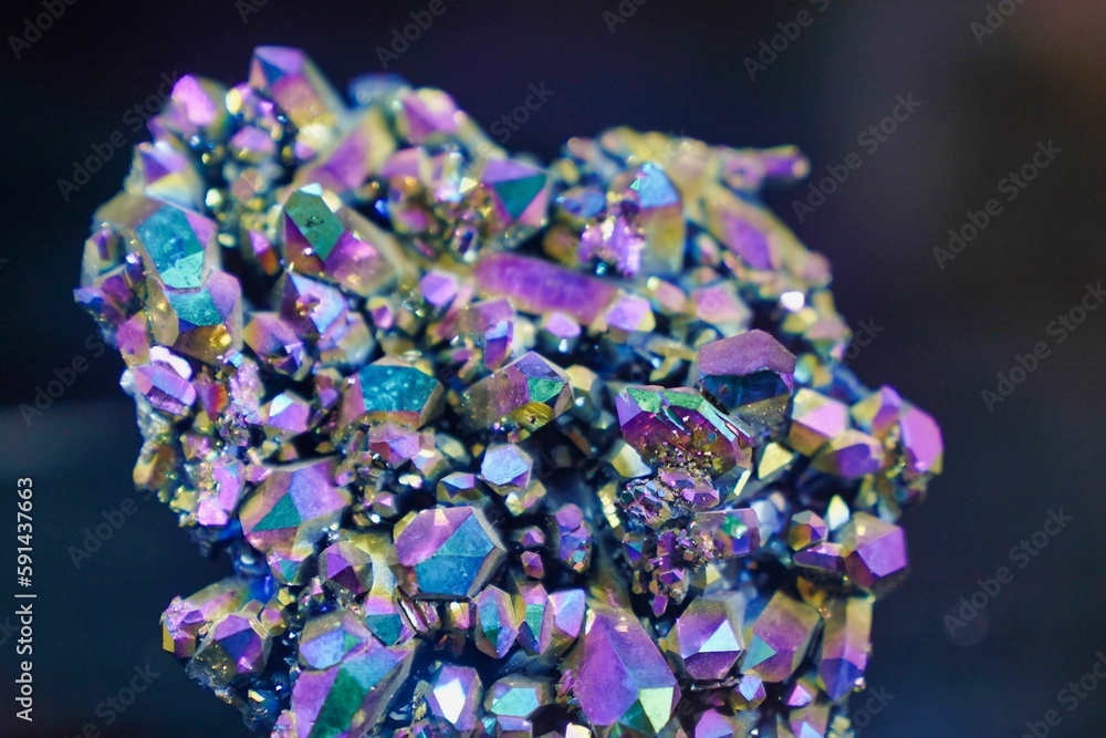 Macro shot of crystal cluster quartz mineral isolated on a dark background