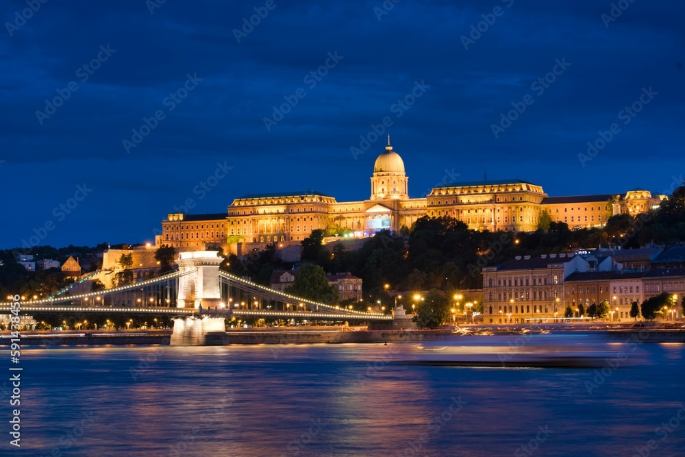 Budapest cityscape with Buda castle, Chain bridge, and Danube river in the evening, Hungary.