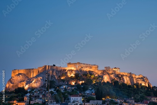 Scenic view of the Acropolis of Athens citadel on a rocky outcrop above the city at night