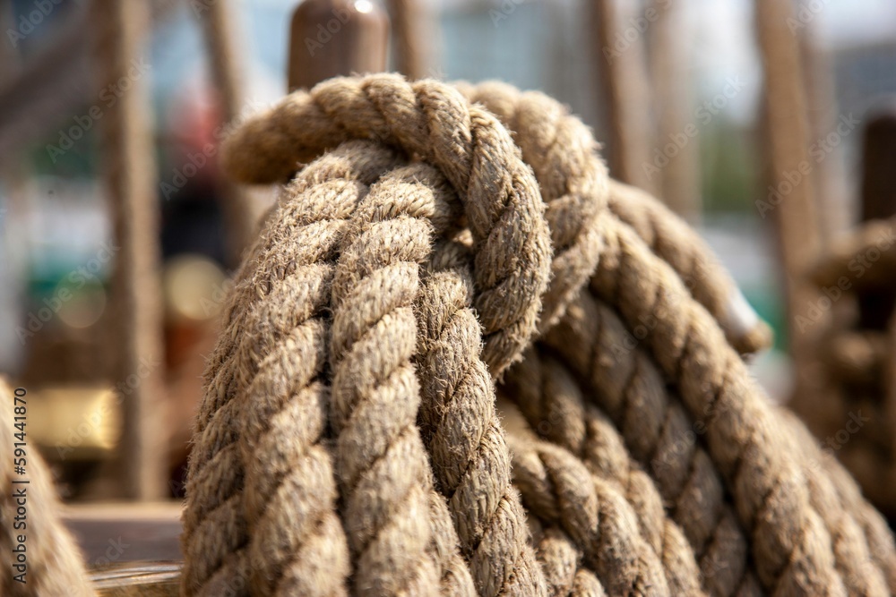 Strong ropes for sailing hanging on a wooden pole