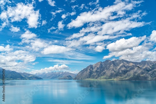 Aerial view of lake surrounded by mountains