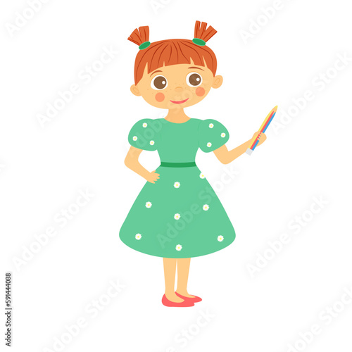 Little redhead girl in a green dress with a pencil