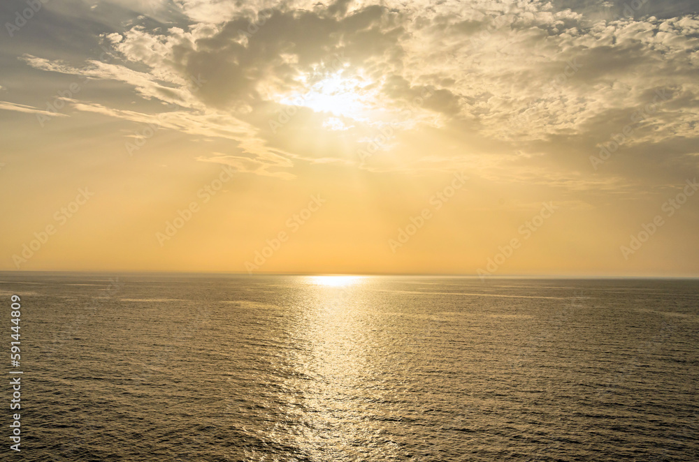Sunrise view from the sea near Santorini island, Greece.