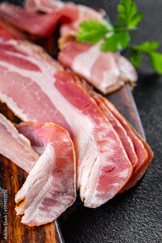 bacon slice fresh pancetta smoked lard meat meal food snack on the table copy space food background rustic top view