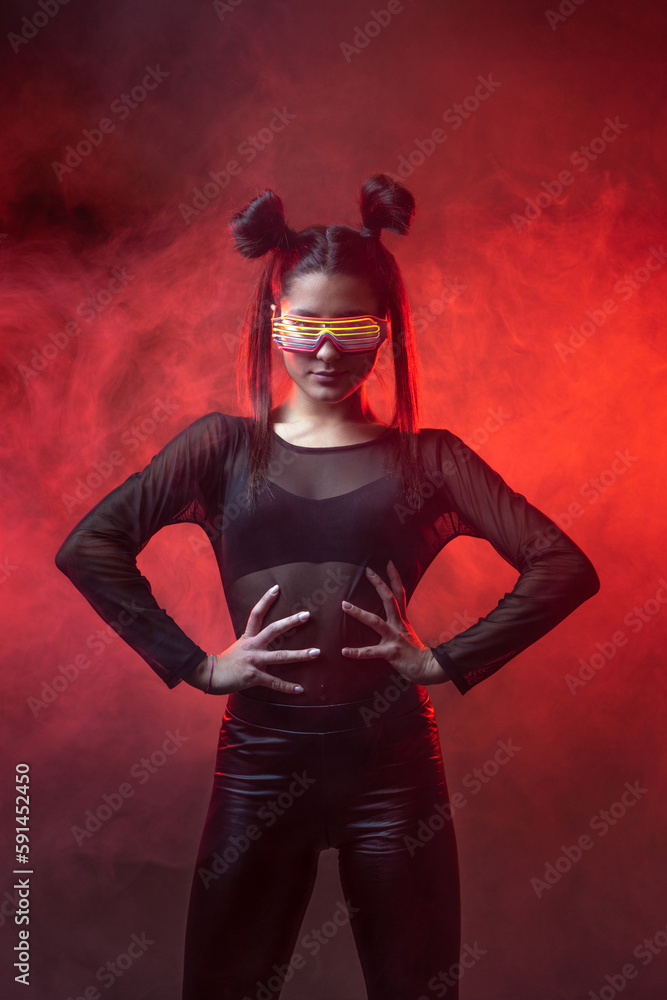 Portrait of beautiful cyber model woman posing wearing led glasses on head with neon light in a virtual tech environment