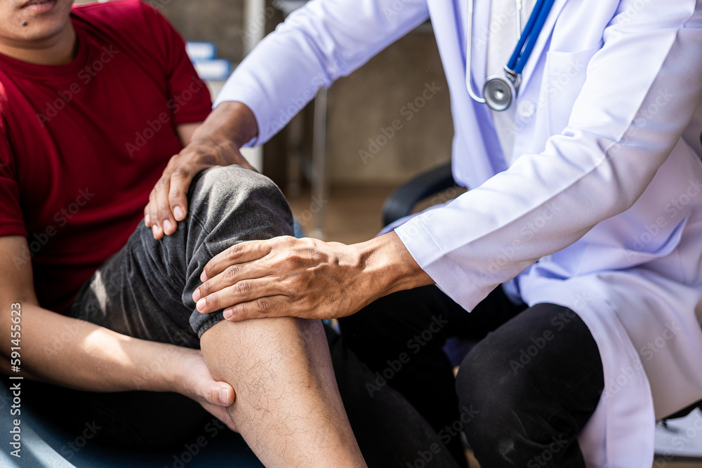 Fototapeta premium Doctor for chiropractic, rehabilitation or knee orthopedic health care. Medical, exercise and treatment work with patient and man for consultation.