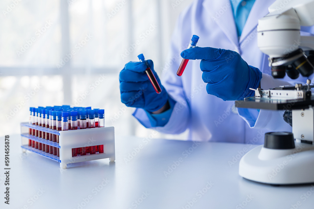 Medical researcher and blue latex gloves to prevent germs Shows a