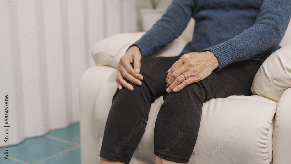knee pain, Asian mature woman close up mature old woman touching knee joint, having painful feelings.