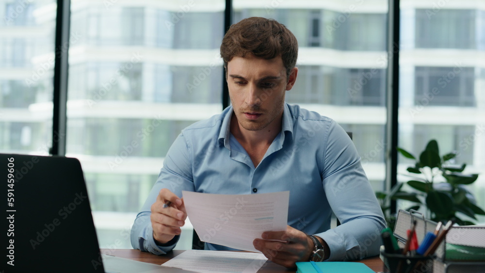 Man entrepreneur feeling exhausted working at office desk with laptop close up Man entrepreneur feeling exhausted working at office desk with laptop close up