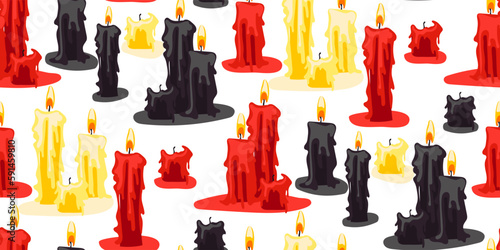 A pattern from a set of candles of varying degrees of burnout on a white background. Red, black, yellow candles for divination in groups. Gift wrapping for Halloween. The candles are burning