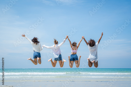 Young woman playing together on tropical beach at summer,Summer vacation concept.