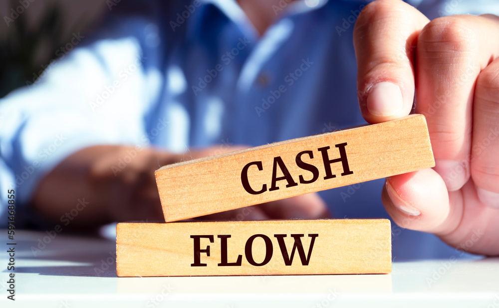 Close up on businessman holding a wooden block with 