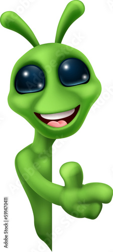 An alien cute little green man Martian cartoon mascot peeking around a sign and pointing