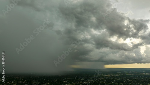 Εκτύπωση καμβά Dark stormy clouds forming on gloomy sky during heavy rainfall season over subur