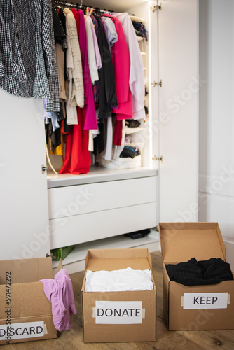 Cuadro en lienzo No people open wardrobe clothes and three cardboard boxes