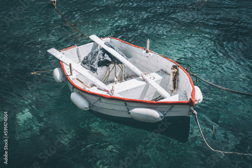 Rowboat moored in harbor, Santorini, Greece