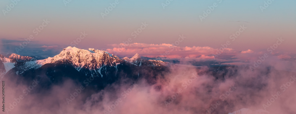 Coastal Canadian Mountain Landscape covered in Snow. Aerial View from Airplane. Near Vancouver, British Columbia, Canada. Nature Background. Panorama