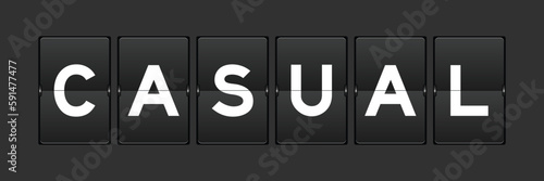 Black color analog flip board with word casual on gray background