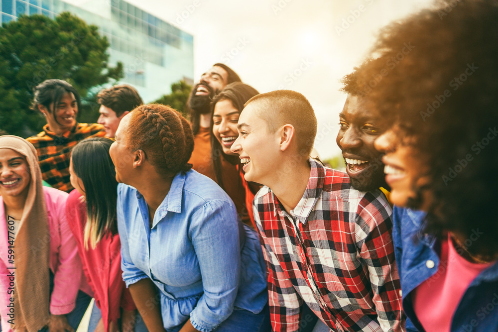 Naklejka premium Young diverse people having fun outdoor laughing together - Focus on bald girl face