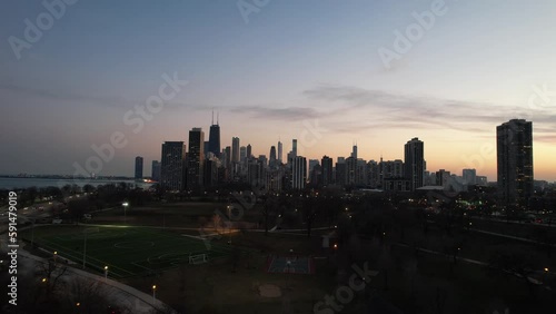 Sunset lakeshore moment during wintertime Chicago. Iconic city of chicago skyline. photo