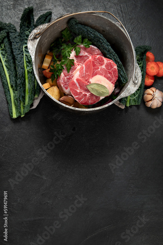Metal spoon and food ingredients on dark background. Health cooking concept.