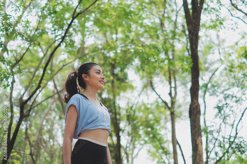 An Asian female is exploring the nature while running. Concept of recreation, Weekend break, discovery, positive energy, happiness, carefree, traveler, Alone and solitude, lifestyle activity freedom. An Asian female is exploring the nature while running. Concept of recreation, Weekend break, discovery, positive energy, happiness, carefree, traveler, Alone and solitude, lifestyle activity freedom.