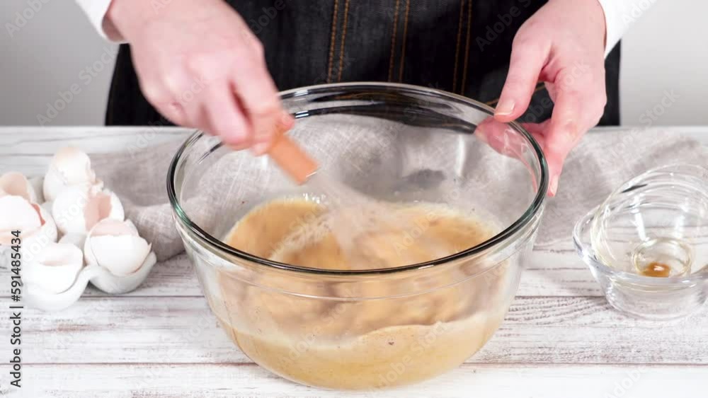 Time lapse. Mixing ingredients in a large glass mixing bowl to prepare French toast. Time lapse. Mixing ingredients in a large glass mixing bowl to prepare French toast.